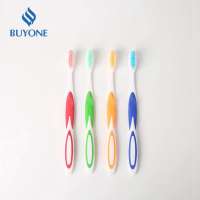 Ergonomic handle design silicone anti-slip toothbrush with end-rounded bristles